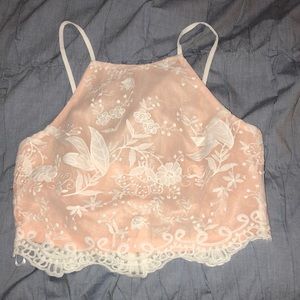 pink and white lace crop top with see through back